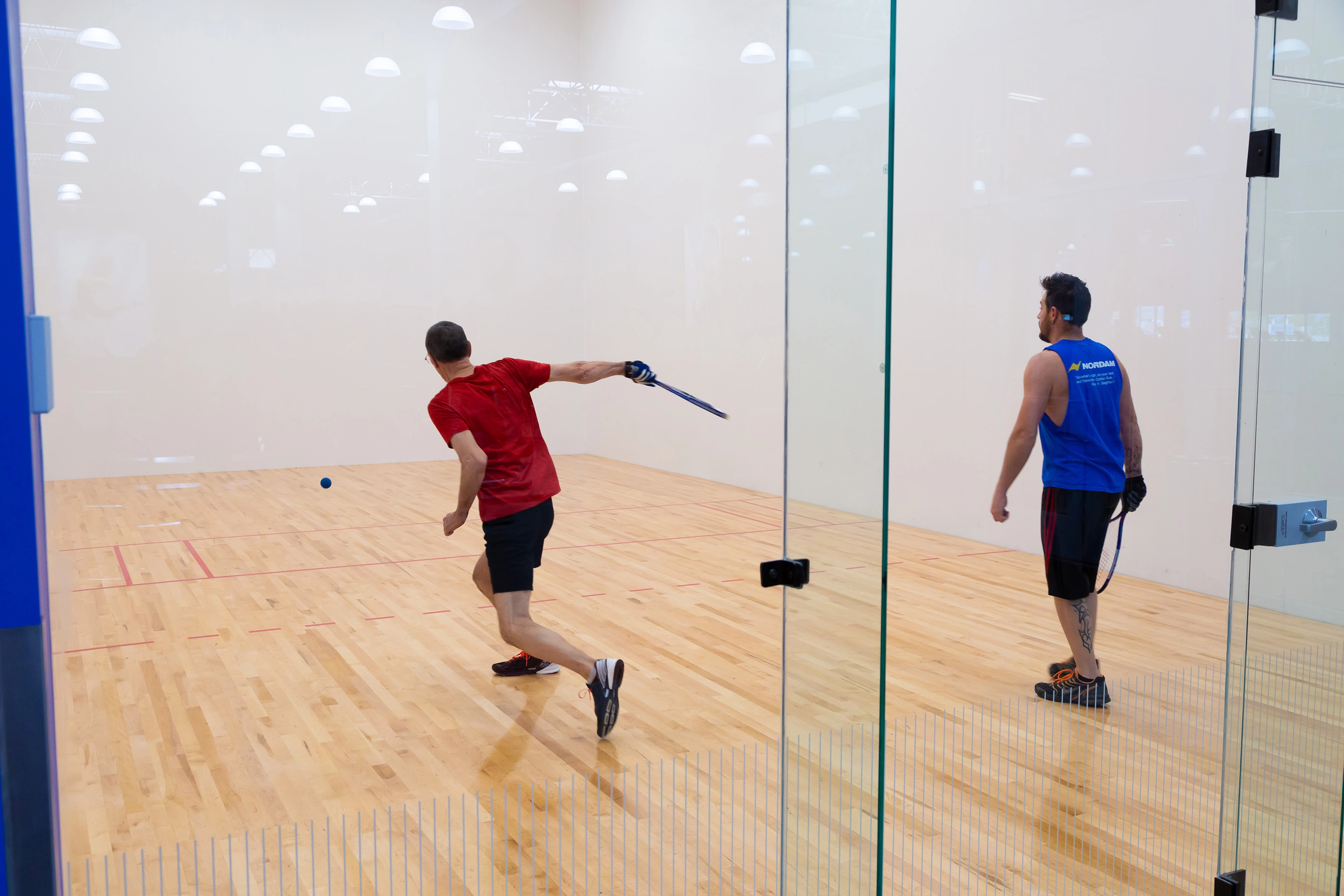 Playing in VASA Fitness racquetball court
