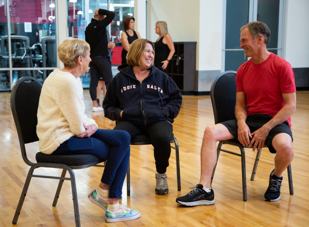 A group of seniors sitting and talking at a VASA gym