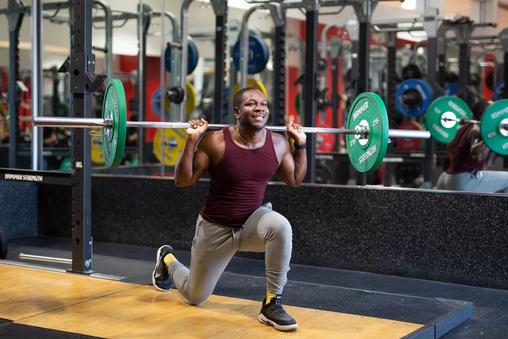 Male athlete doing a barbell exercise in the performance lifting area at VASA Fitness