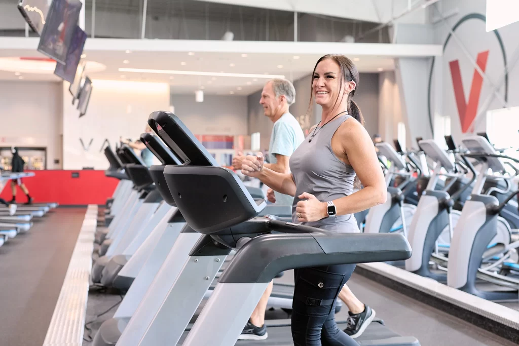 Female athlete walking on a treadmill in the cardio deck on VASA Fitness