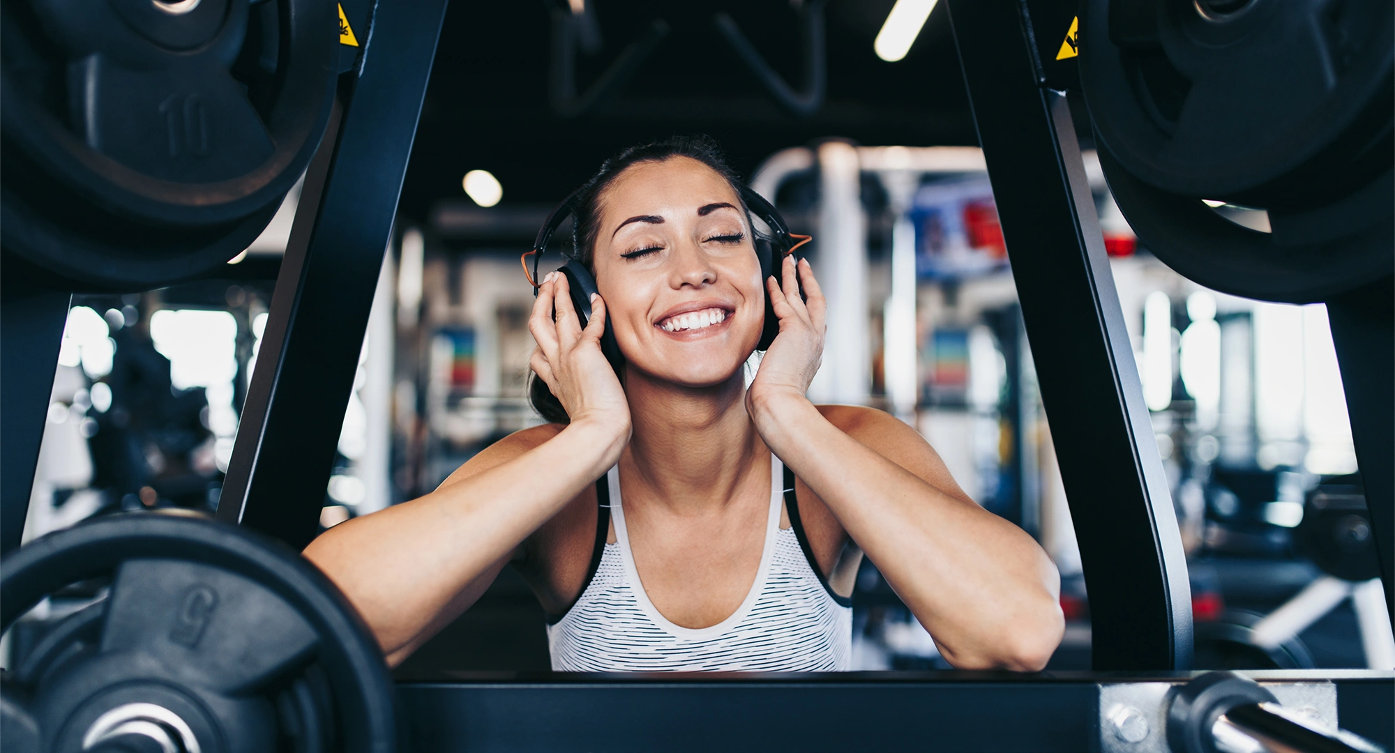 Women listening to an energized playlist at the gym